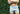 Shirtless man standing arms crossed in front of bush wearing gray slim fit boxer.