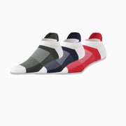 3 pairs of performance ankle socks on light grey background. One hunter/cream, one navy blue/cream, one red/cream. 