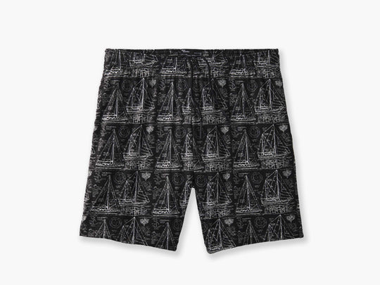 "Schooner" mesh lounge shorts that are black with white illustrations of boats laid flat on light grey background.