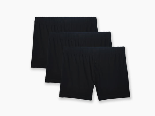3 pairs of black slim fit boxers on light grey backgorund.
