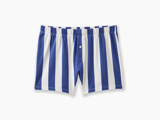 Navy and cream stripe colored slim fit boxers laid flat on light gray background.