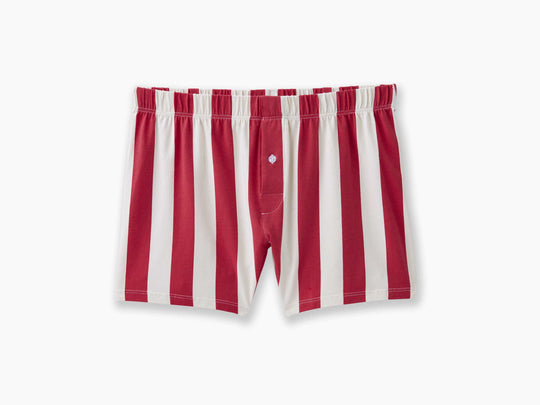 Red and cream stripe colored slim fit boxers laid flat on light gray background.