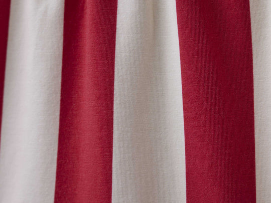 Close up detail shot of red and cream stripe slim fit boxer. 