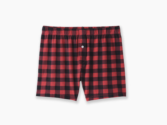 Pair of red and black checkered stripe slim fit boxers against a light grey background. 