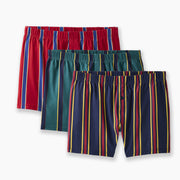3 pairs of various colored striped slim fit boxers sitting against a light grey background.