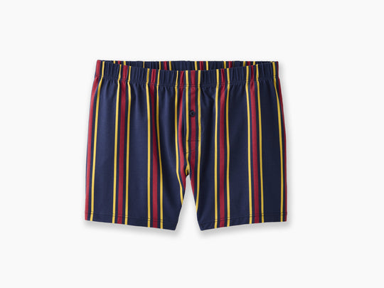 Pair of blue, red, and yellow stripe slim fit boxers on light grey background.