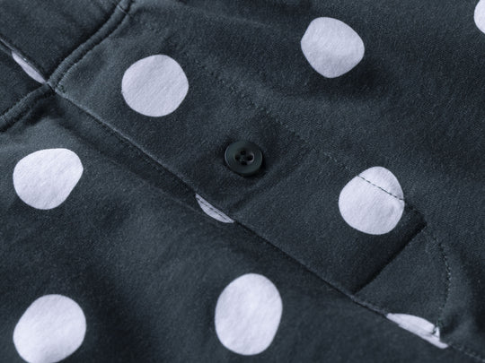 Close up detail shot of green slim fit boxer with white and drawn dots printed.