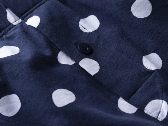 Close up detail shot of navy blue slim fit boxer with white hand drawn dots printed on.