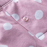 Close up detail shot of pink slim fit boxers with white hand drawn dots printed on.
