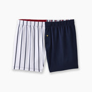Regatta slim fit boxer featuring solid navy and red panels with think stripes on other panels laid flat on light grey background.