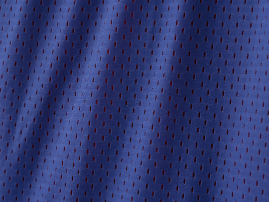 Very close up detail shot of blue mesh material.