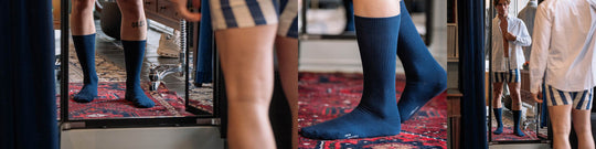 Man in blue red socks in red carpet looking into the mirror. 3 similar vantage point photos of it.