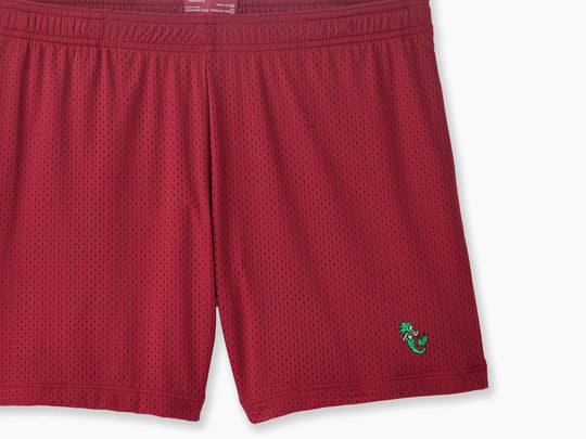 Burgundy pocket lounge short with mermaid embroidery on bottom right of leg.