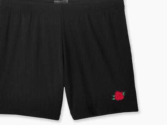 Black pocket lounge short with rose embroidery on bottom right of leg.