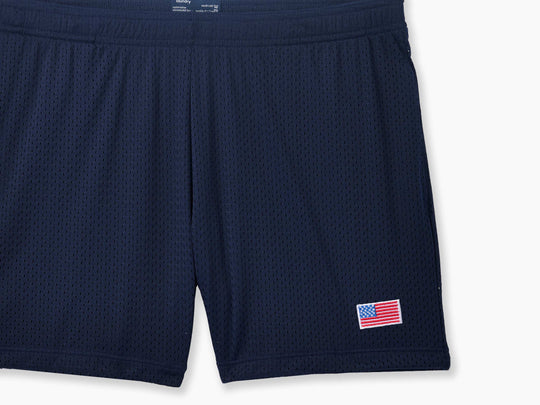 Navy Blue pocket lounge short with American flag embroidery on bottom right of leg.