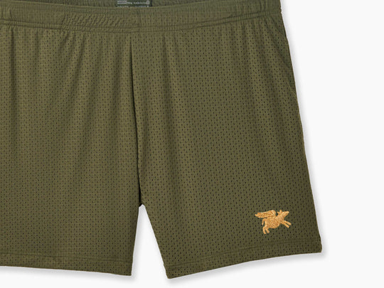 Olive pocket lounge short with gold flying pig embroidery on bottom right of leg.