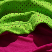 Macro texture of lime outer mesh and inner pink micromodal.