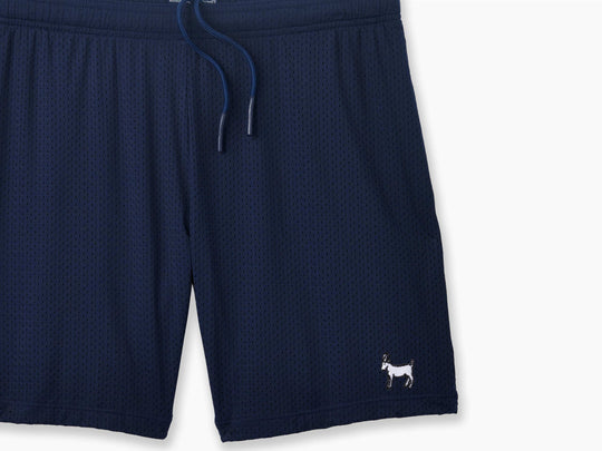 Navy Blue pocket lounge short with goat embroidery on bottom right of leg.