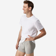 Side view of man wearing heather grey boxer brief.
