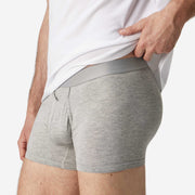 Close up side view of man wearing heather grey boxer brief.