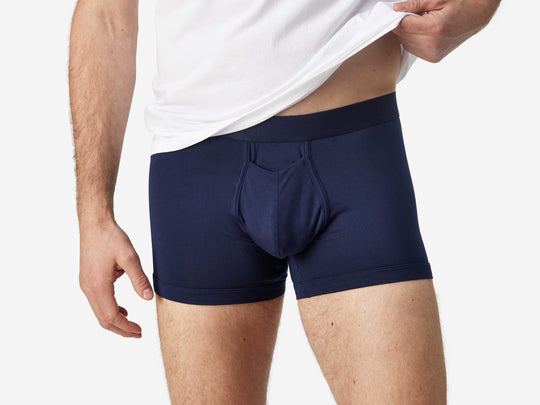 Front view of man wearing navy blue boxer brief.