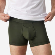 Close up front view of man wearing olive boxer brief.
