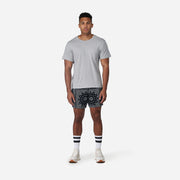 4" Bandana Pocket Lounge Short on model front view with grey background.