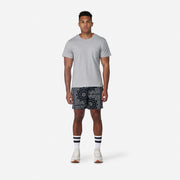 6" Bandana Pocket Lounge Shorts on model with grey t shirt and tech varsity socks (full body shot).