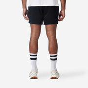 Backside view of mean wearing black lounge short.