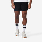Frontside view of mean wearing black lounge short.