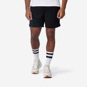 Close up shot of man wearing black lounge short.