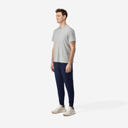 Fully body side view of man wearing navy blue lounge pant. 