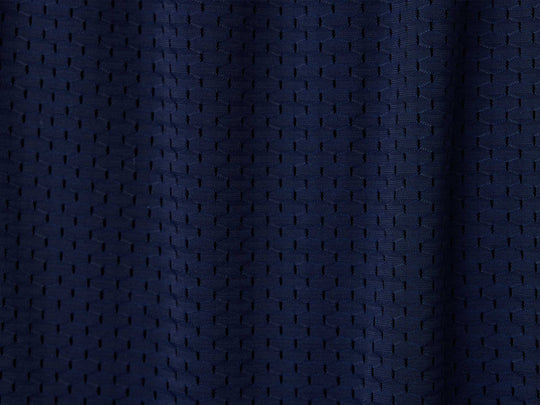 Close up detail shot of navy blue mesh texture.
