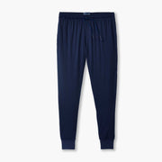 Navy blue lounge pants laid flat on grey background.