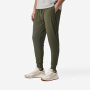 Side view shot of man wearing olive lounge pant.