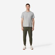 Front fully body view shot of man wearing olive lounge pant.