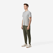 Side fully body view shot of man wearing olive lounge pant.