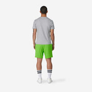 4" Melon Pocket Lounge Short on model back view with grey background.