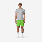 4" Melon Pocket Lounge Short on model front view with grey background.