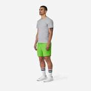 4" Melon Pocket Lounge Short on model side view with grey background.