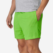 4" Melon Pocket Lounge Short on model hands in the pocket.
