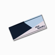 Monogram gift box with navy, light blue, white design.