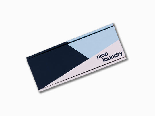 Monogram gift box with navy blue, light blue, white design.