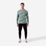 Full body front view of man wearing palms print lounge hoodie.