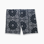 Black bandana printed on slim fit boxer laid flat against gray background.