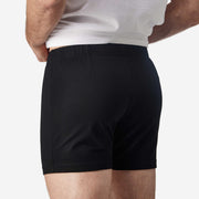 Close up back view of man wearing black slim fit boxer and white t-shirt.