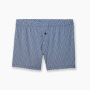 Blue herringbone pattern on slim fit boxer laid flat on grey background.