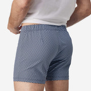Close up side back of man wearing blue herringbone slim fit boxer and white t-shirt.
