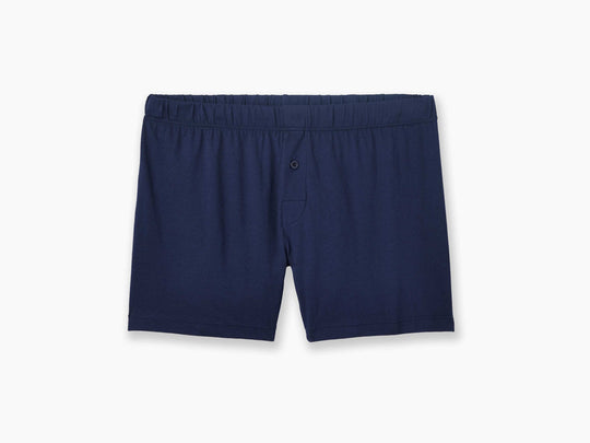 Navy blue slim fit boxers laid flat on grey background.