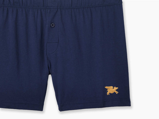 Navy Blue slim fit boxer with golden flying pig embroidery in bottom right corner.